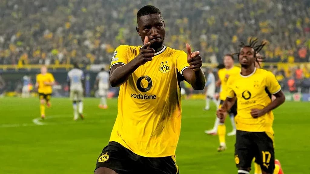 Player celebrating a goal in Borussia Dortmund kit Player celebrating a goal in Borussia Dortmund kit