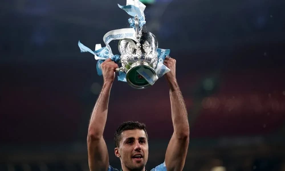 Player holding trophy aloft after winning match Player holding trophy aloft after winning match