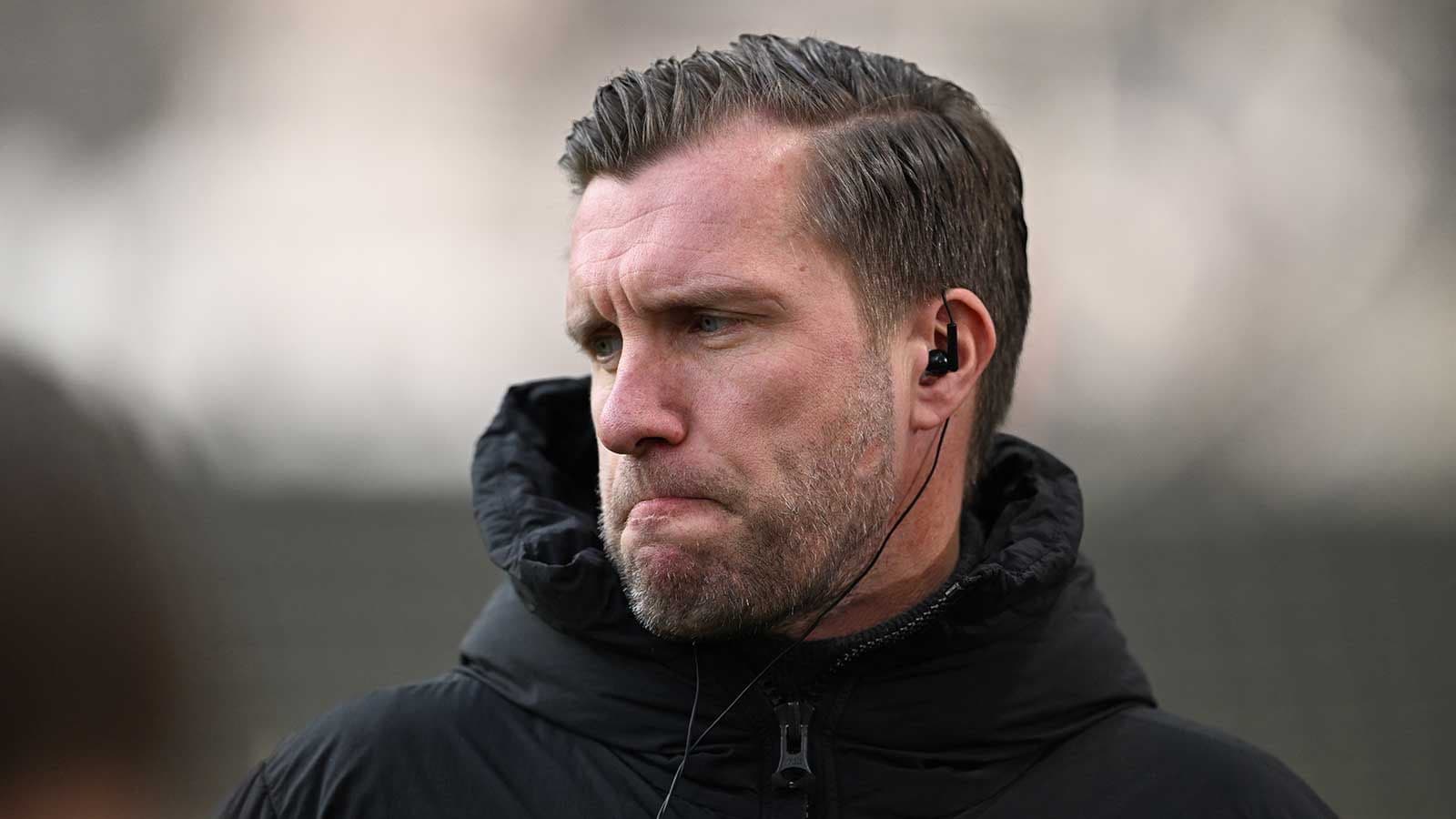 Coach wearing earphones during training session Coach wearing earphones during training session
