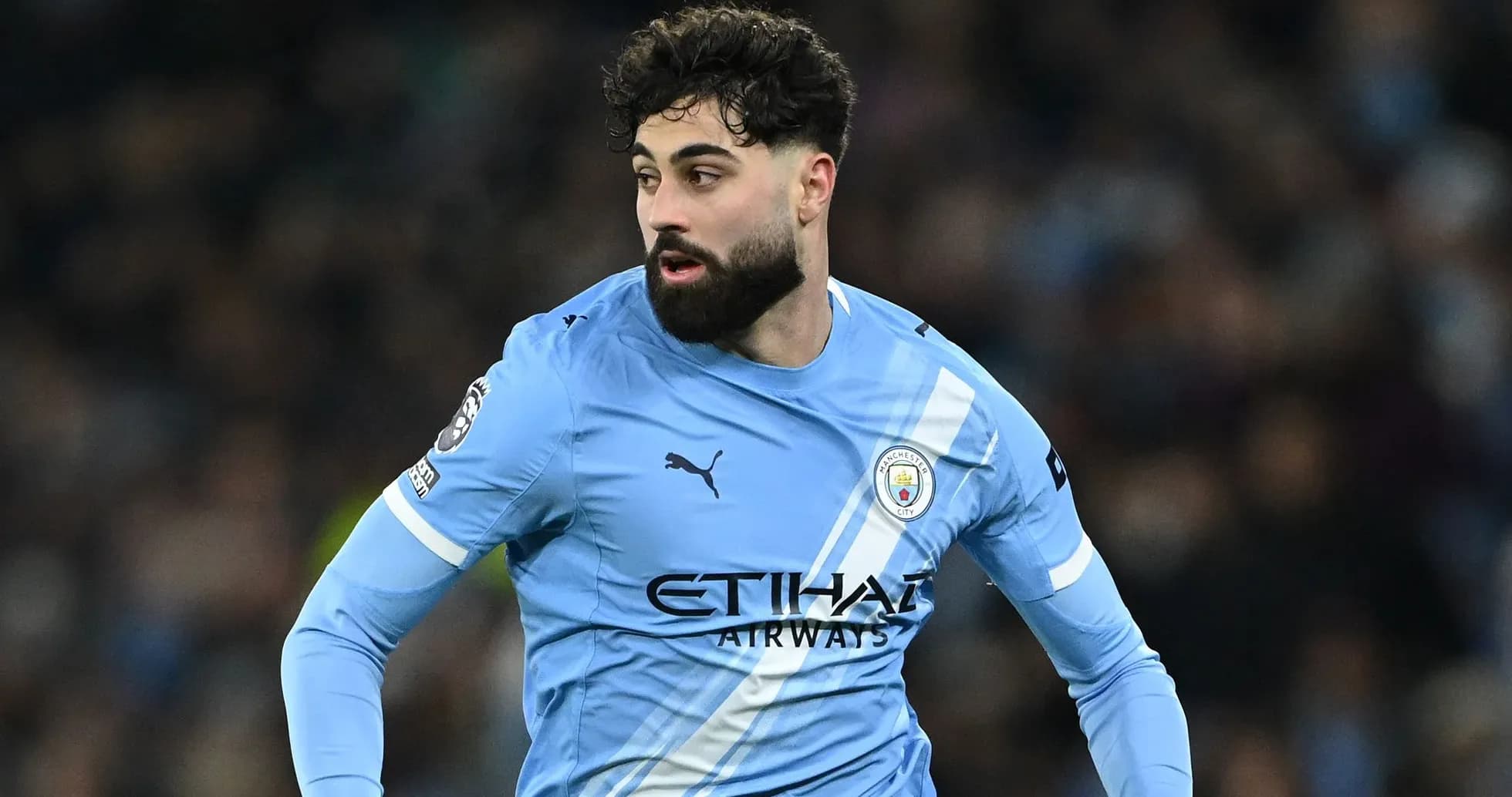 Player in light blue Manchester City jersey during match Player in light blue Manchester City jersey during match