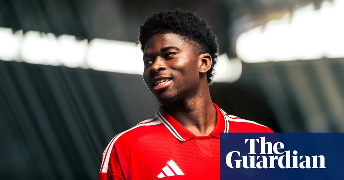 Player wearing red jersey smiling during photo shoot Player wearing red jersey smiling during photo shoot
