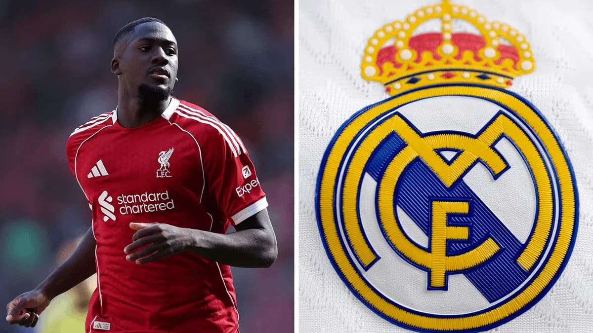 Player in Liverpool kit next to Real Madrid logo Player in Liverpool kit next to Real Madrid logo