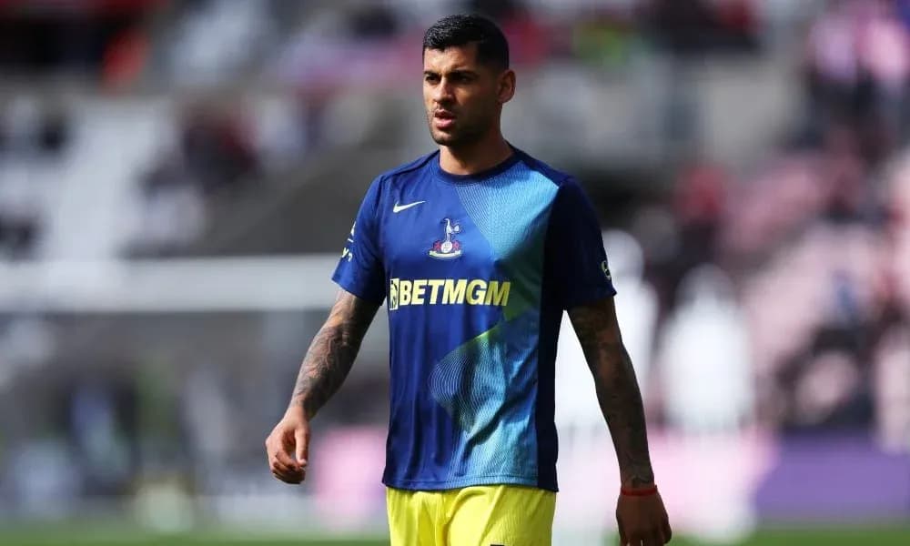 Player walking on the pitch in warm-up gear Player walking on the pitch in warm-up gear