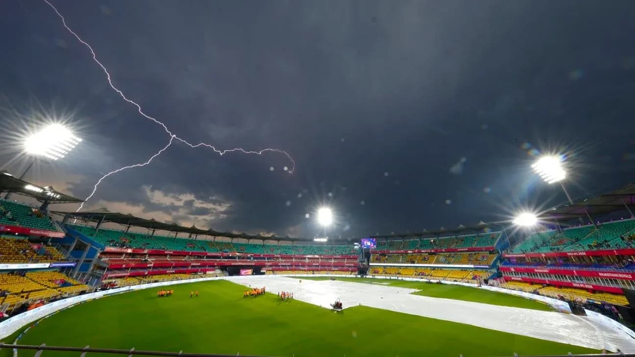 Cricket stadium under stormy sky with lightning Cricket stadium under stormy sky with lightning