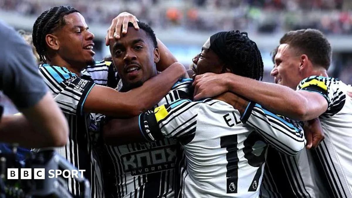 Newcastle players celebrating a goal together Newcastle players celebrating a goal together