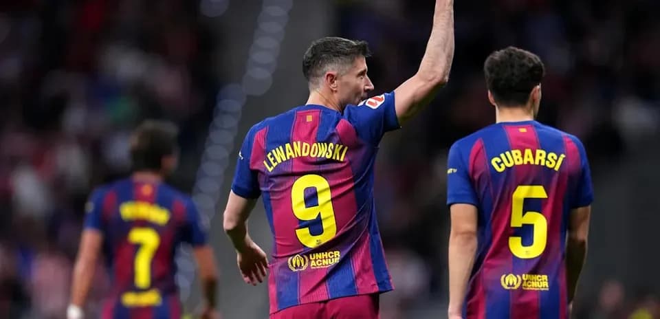 Lewandowski celebrating with teammates during match Lewandowski celebrating with teammates during match