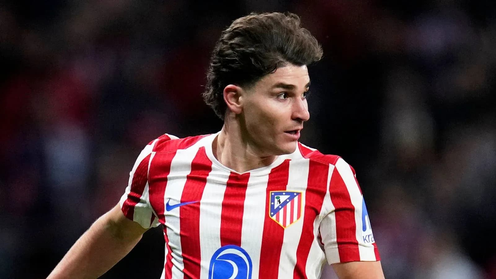 Atletico Madrid player in red and white jersey Atletico Madrid player in red and white jersey