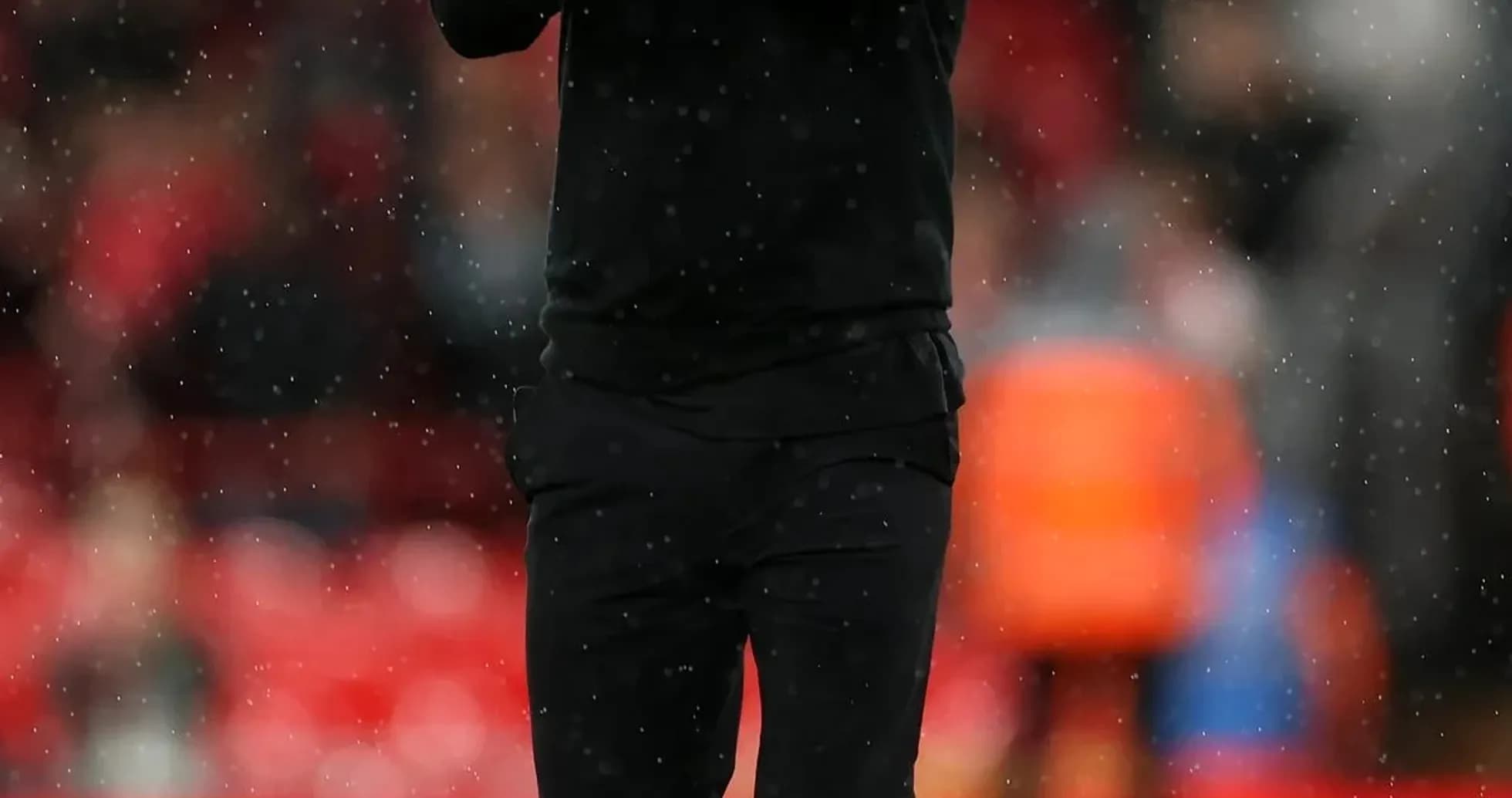 Coach applauding on the pitch during match Coach applauding on the pitch during match