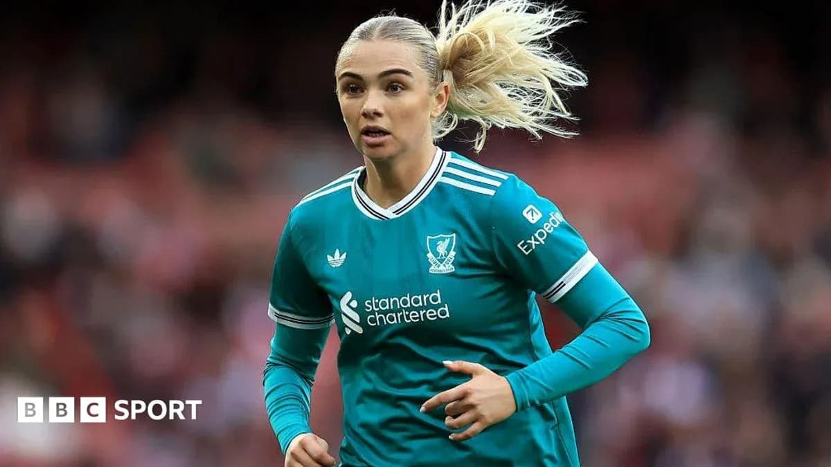 Player in teal kit running during a match Player in teal kit running during a match