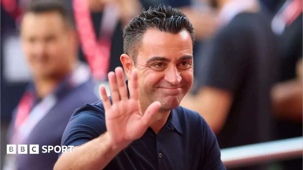 Coach waving to fans during a public event Coach waving to fans during a public event