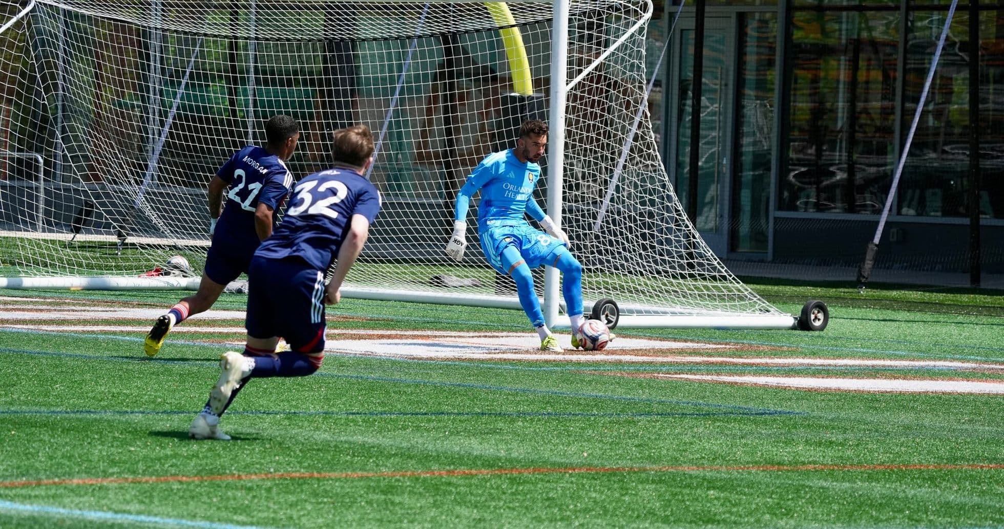 Goalkeeper preparing to make a save in match Goalkeeper preparing to make a save in match