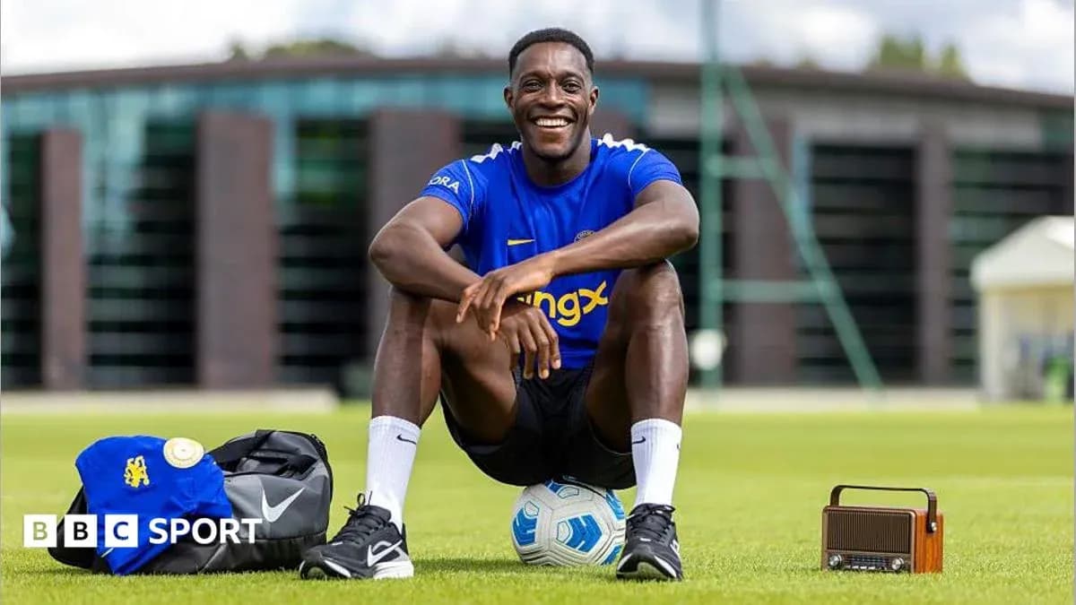 Player smiling while sitting on training ground Player smiling while sitting on training ground