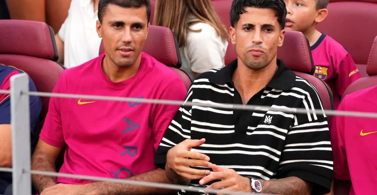 Two men seated in stadium watching match Two men seated in stadium watching match