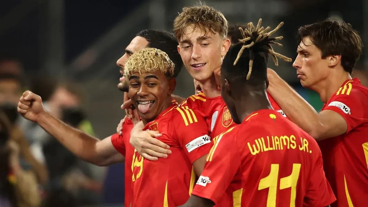 Spanish players celebrating a goal on the field Spanish players celebrating a goal on the field