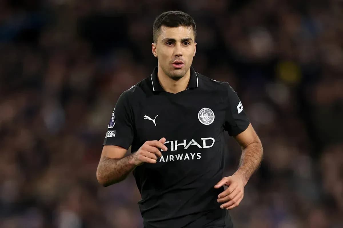 Player running on field in Manchester City kit Player running on field in Manchester City kit
