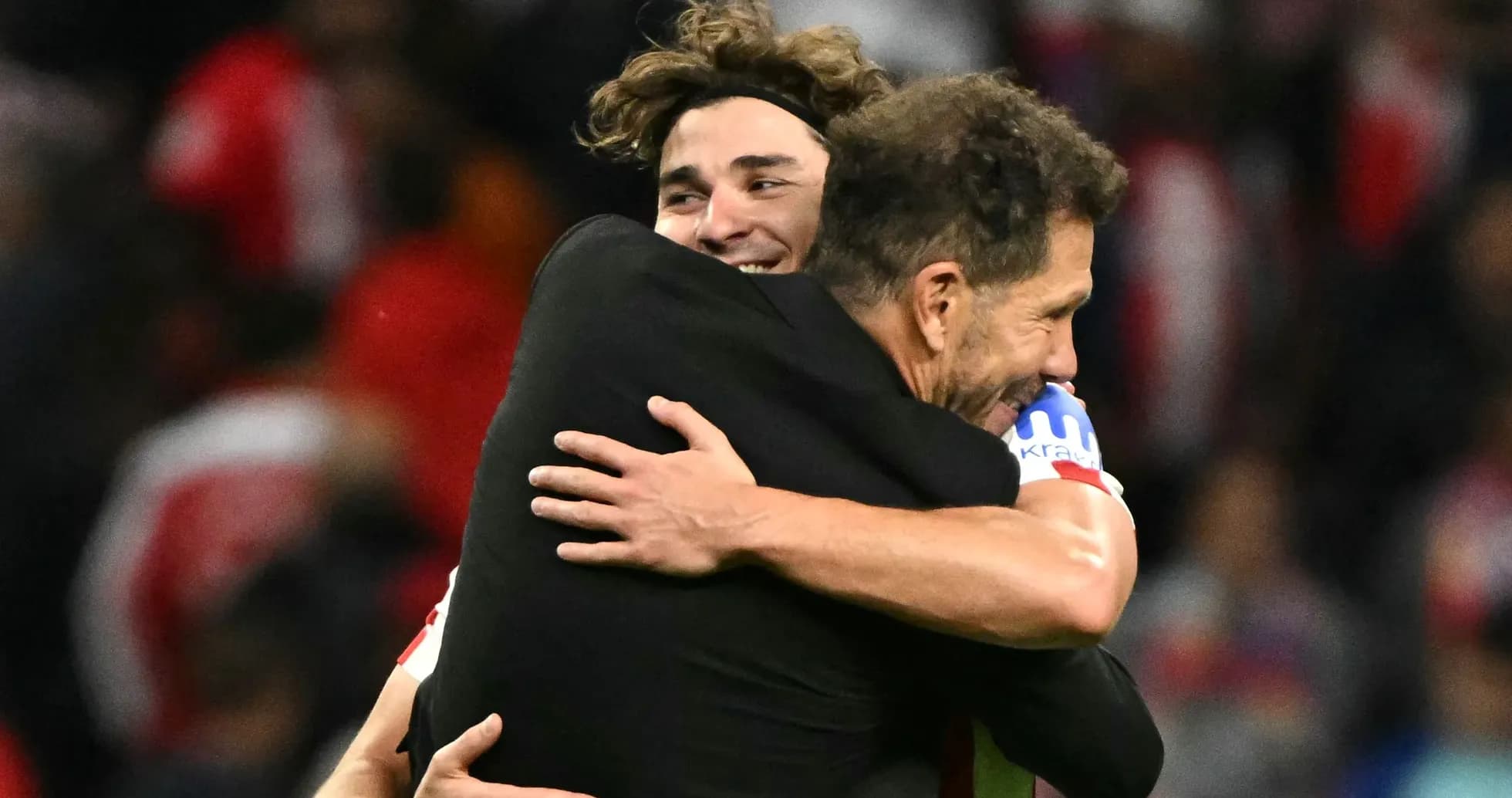Two players embracing after a match victory Two players embracing after a match victory