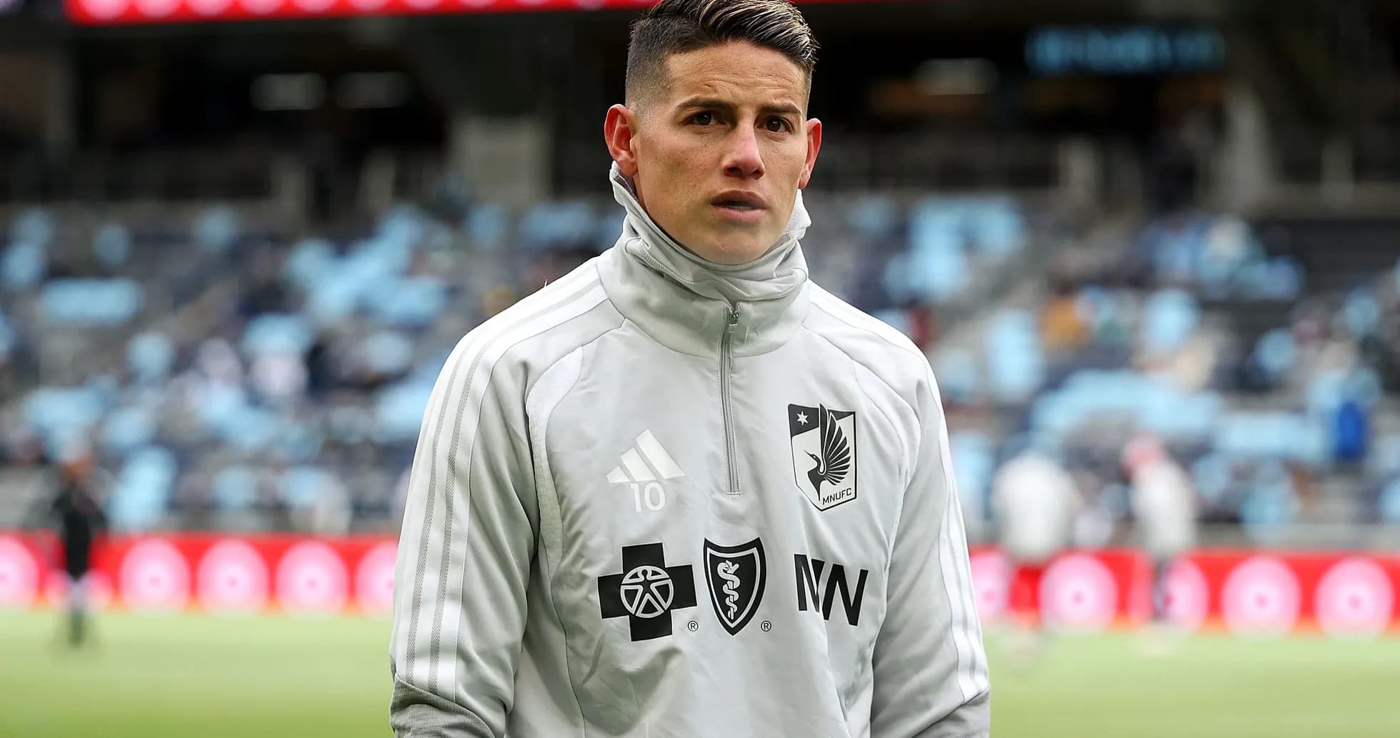 Player in gray training gear at stadium Player in gray training gear at stadium