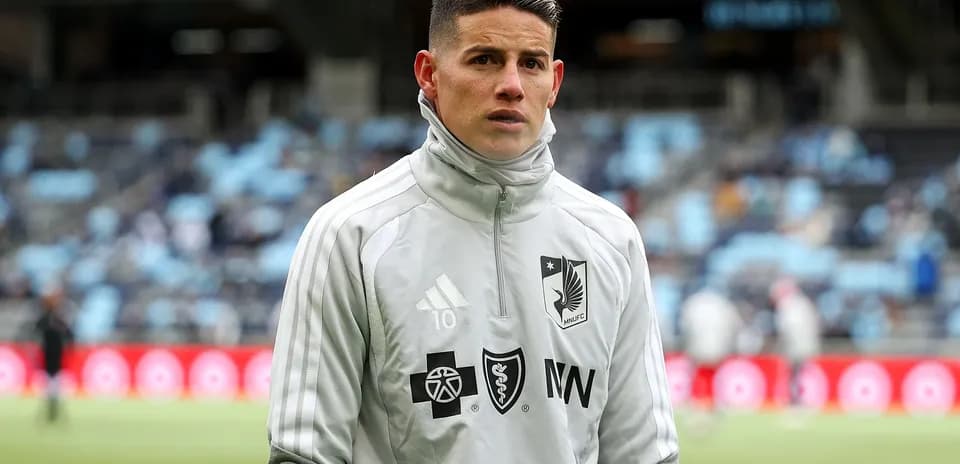 Player in gray training gear at stadium Player in gray training gear at stadium