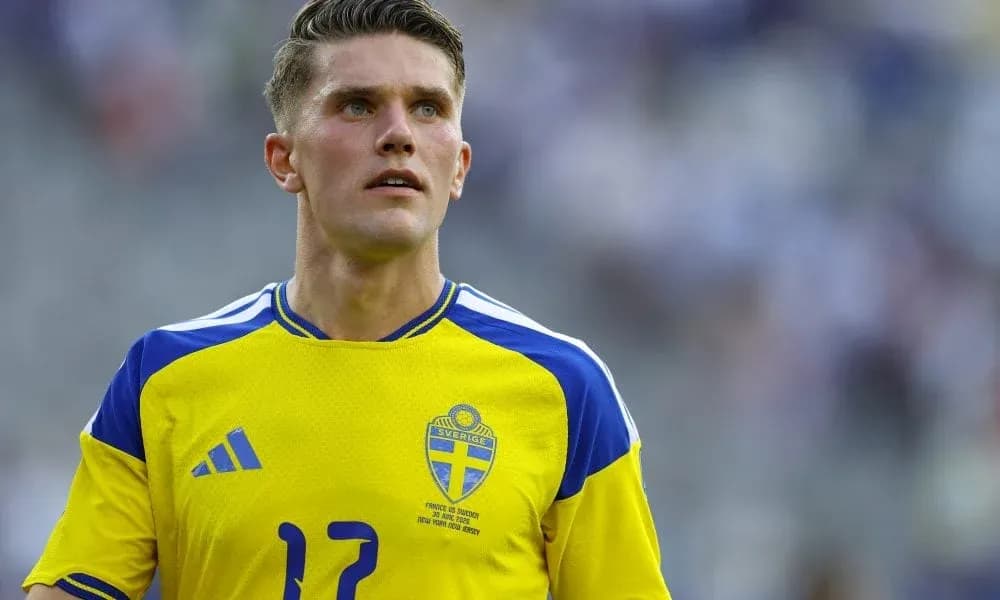 Player in Sweden national team jersey on field Player in Sweden national team jersey on field