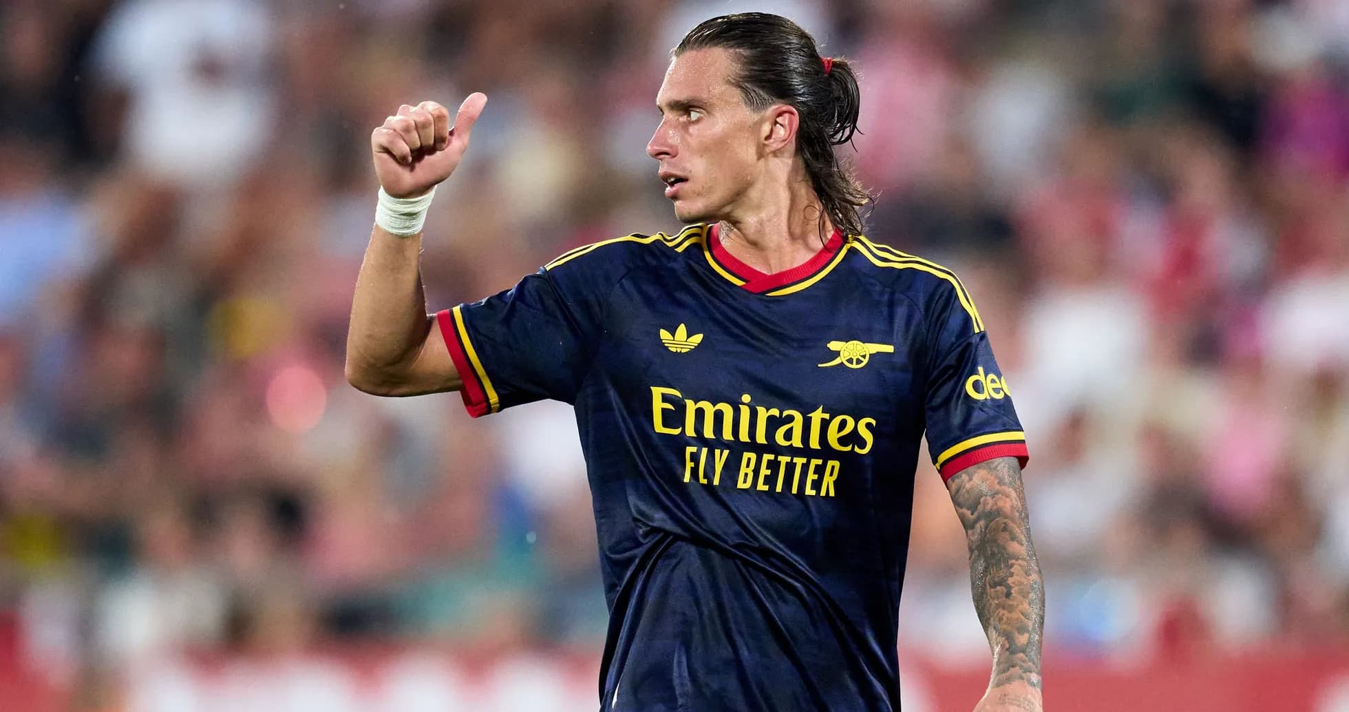 Player gesturing during match in Arsenal jersey Player gesturing during match in Arsenal jersey