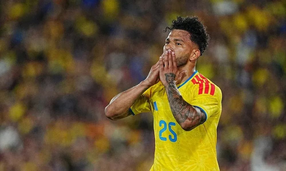 Player in yellow jersey reacting during a match Player in yellow jersey reacting during a match