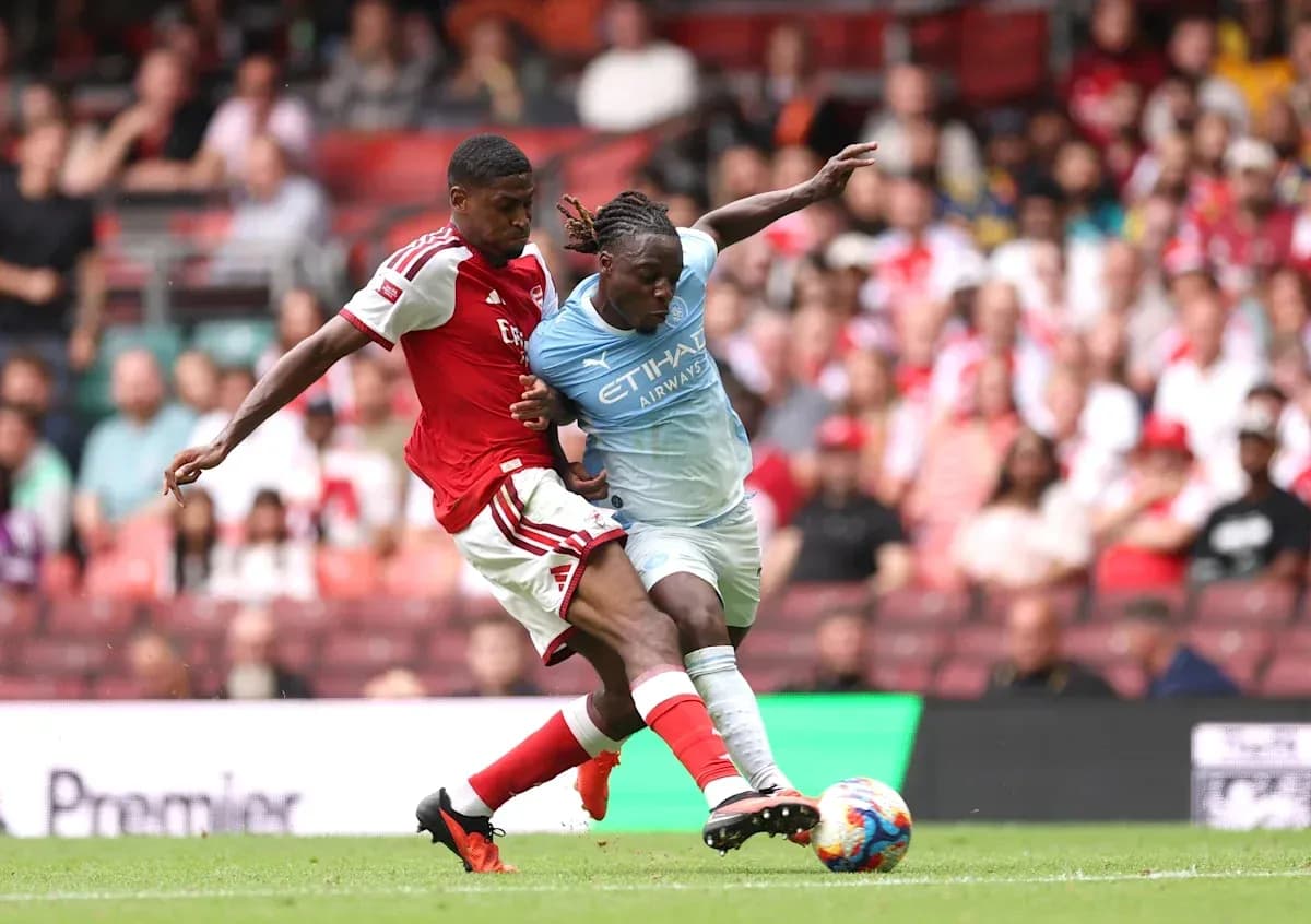 Player tackling opponent during football match Player tackling opponent during football match