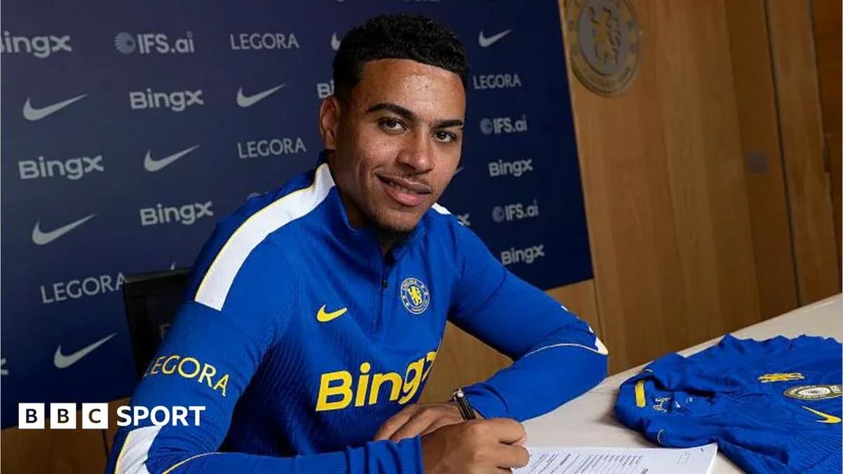 Player signing contract at press conference table Player signing contract at press conference table