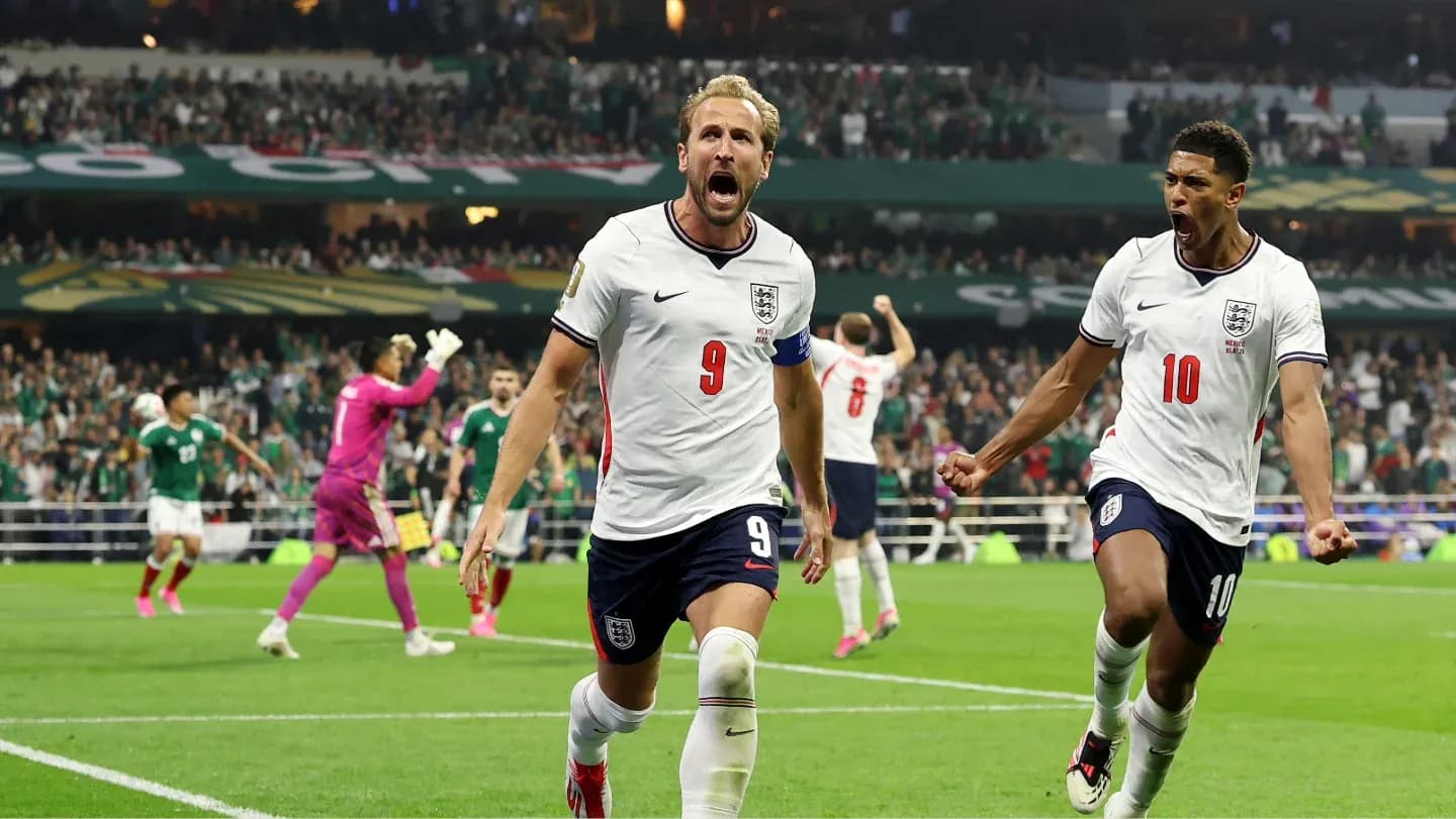 Harry Kane and teammate celebrating a goal Harry Kane and teammate celebrating a goal
