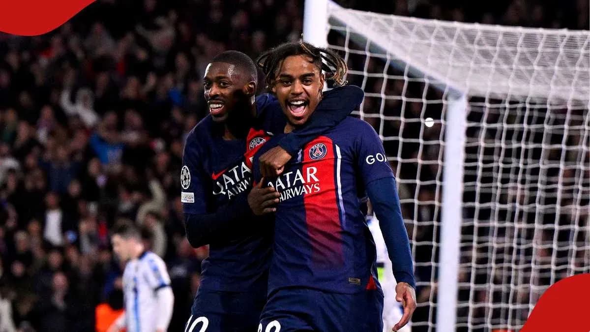 Two PSG players celebrating a goal on the field Two PSG players celebrating a goal on the field