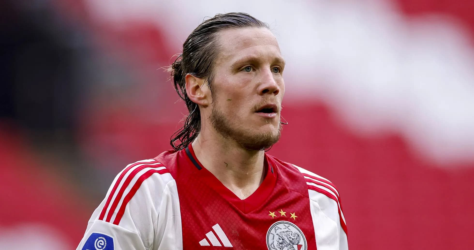 Player in Ajax jersey during match action Player in Ajax jersey during match action