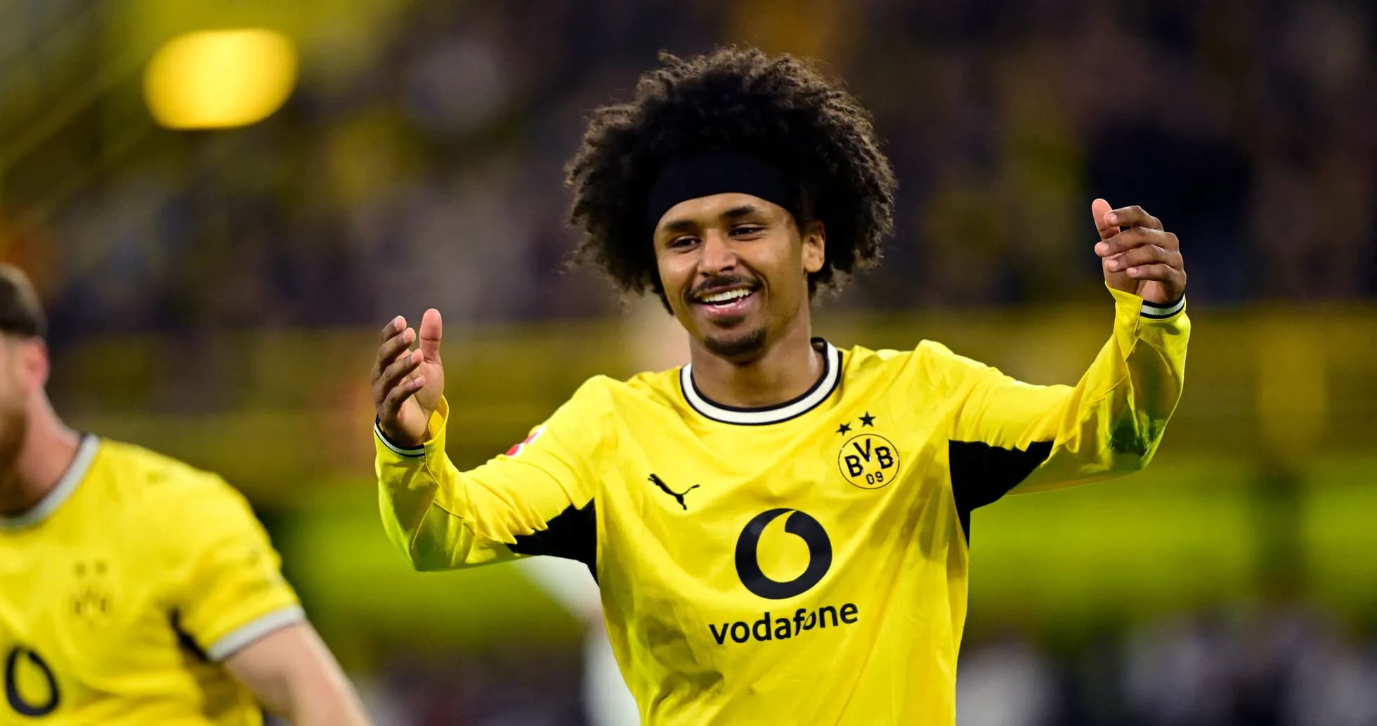 Player celebrating a goal in Borussia Dortmund jersey Player celebrating a goal in Borussia Dortmund jersey