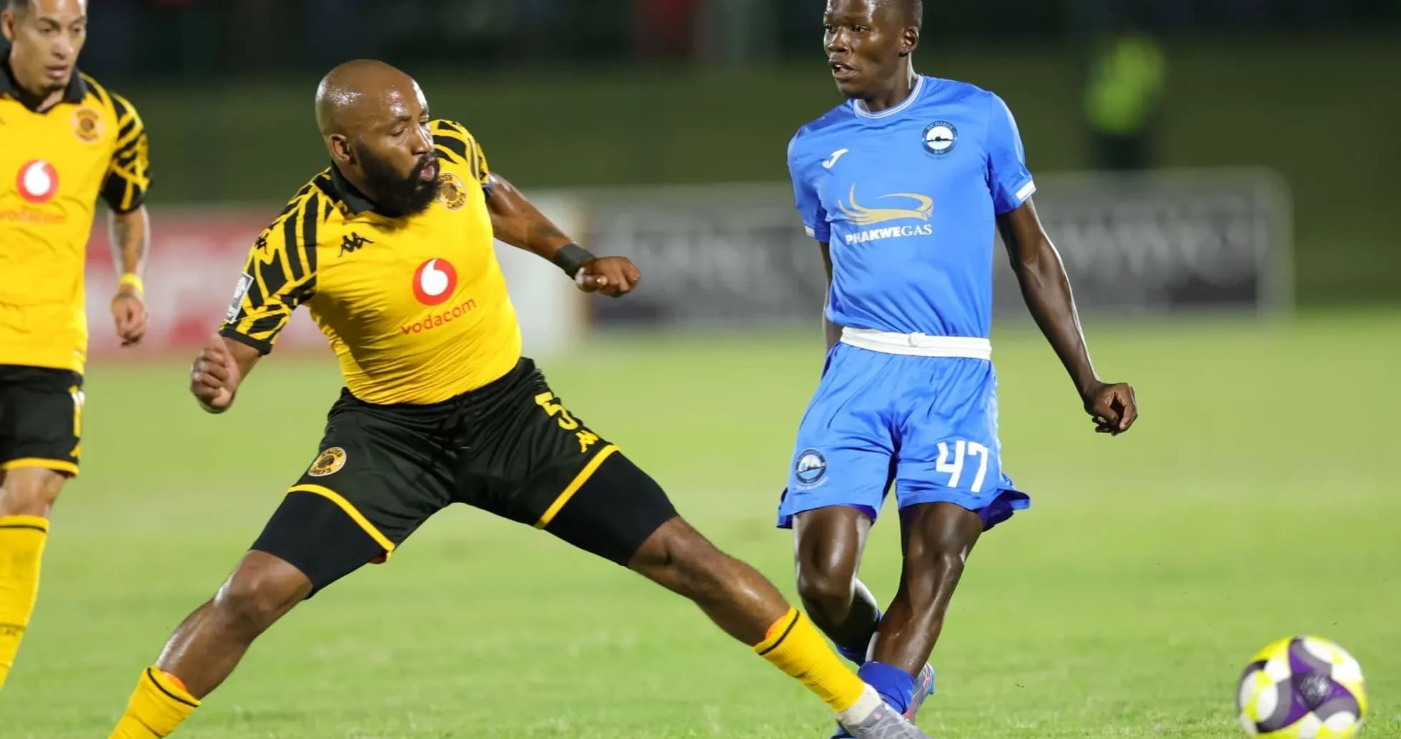 Players competing for the ball during a match Players competing for the ball during a match