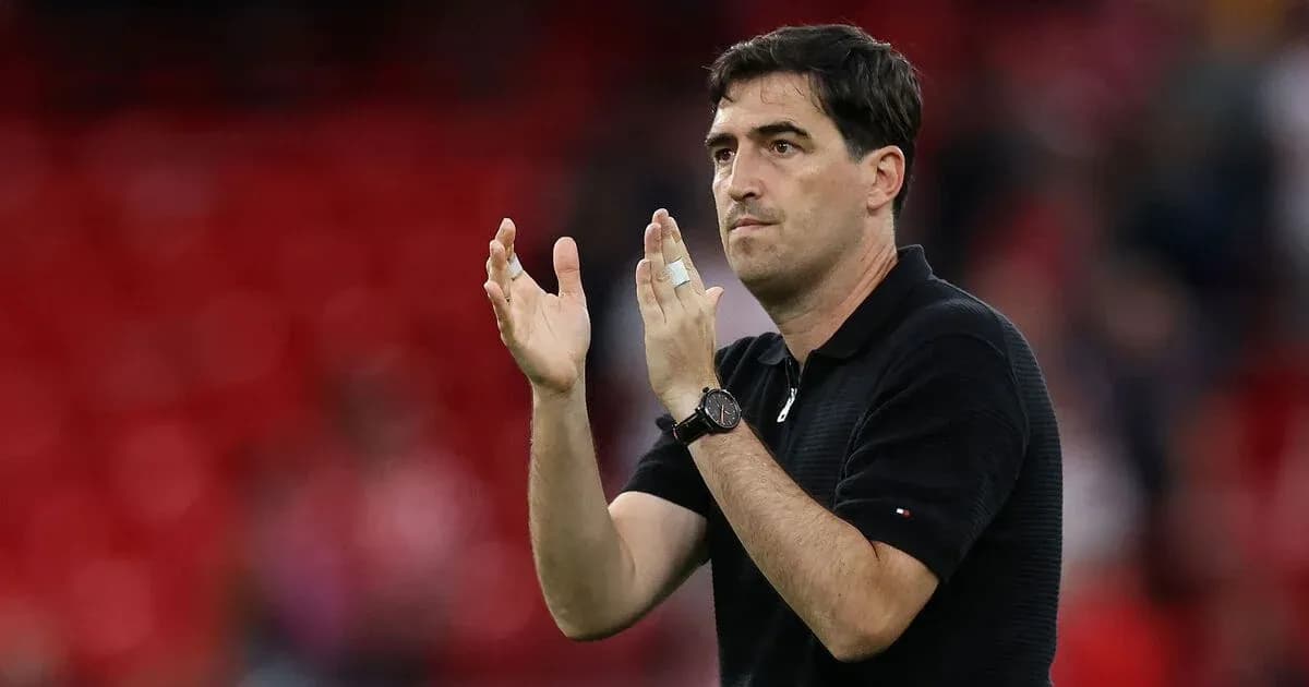 Coach gesturing with hands during match Coach gesturing with hands during match