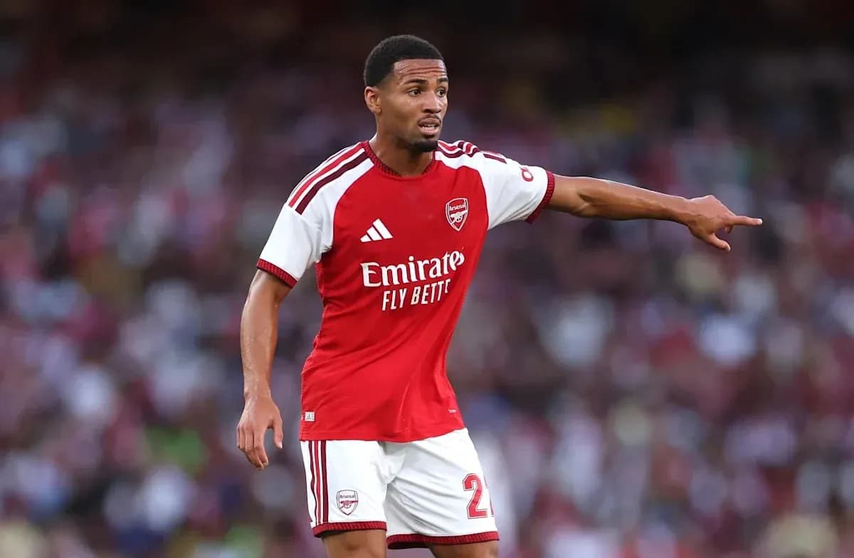 Player in Arsenal kit directing teammates during match Player in Arsenal kit directing teammates during match