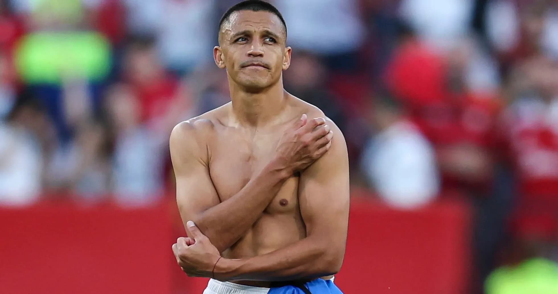 Player with bare torso standing on the field Player with bare torso standing on the field