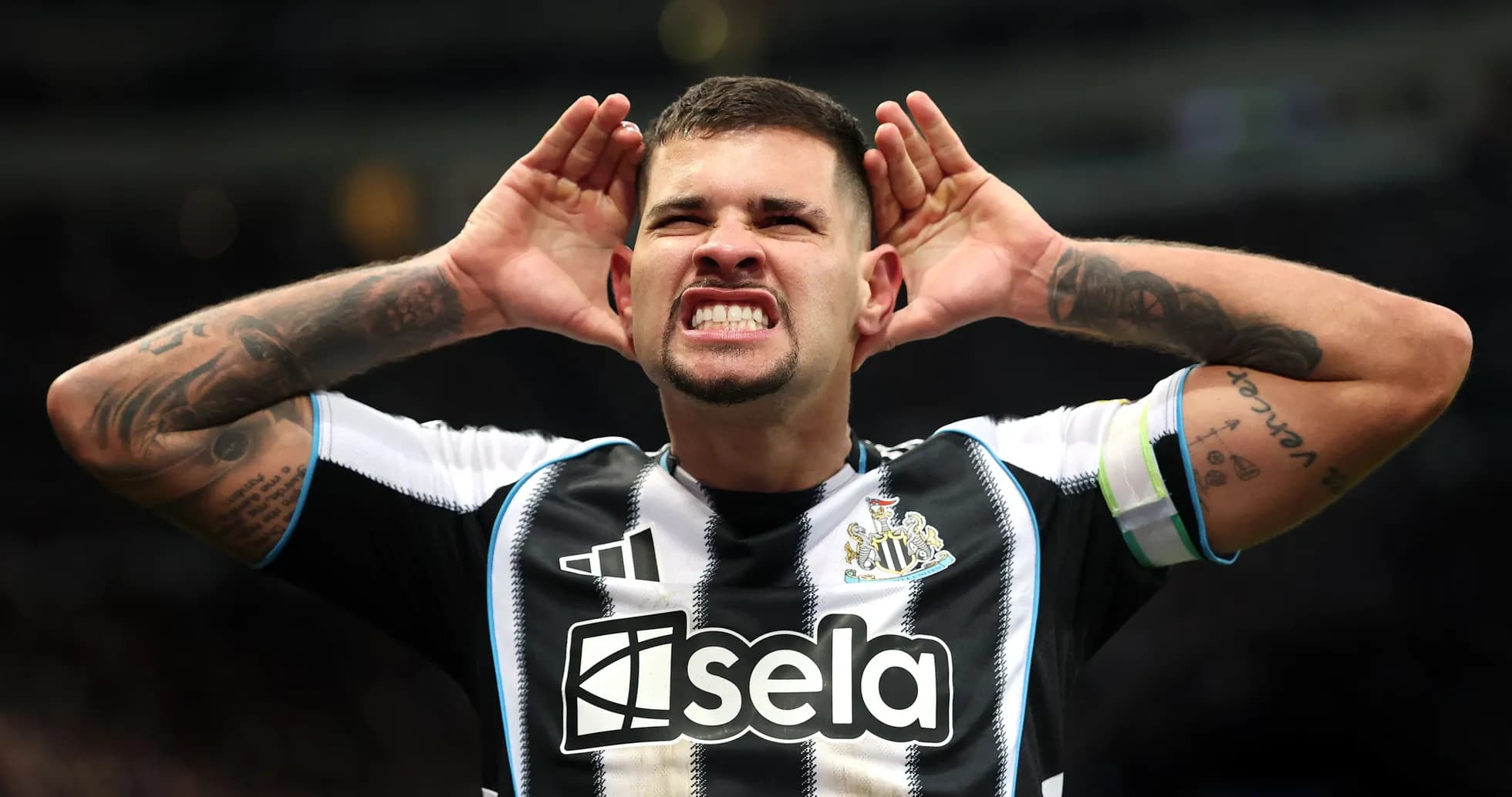 Player celebrating and gesturing to fans at stadium Player celebrating and gesturing to fans at stadium