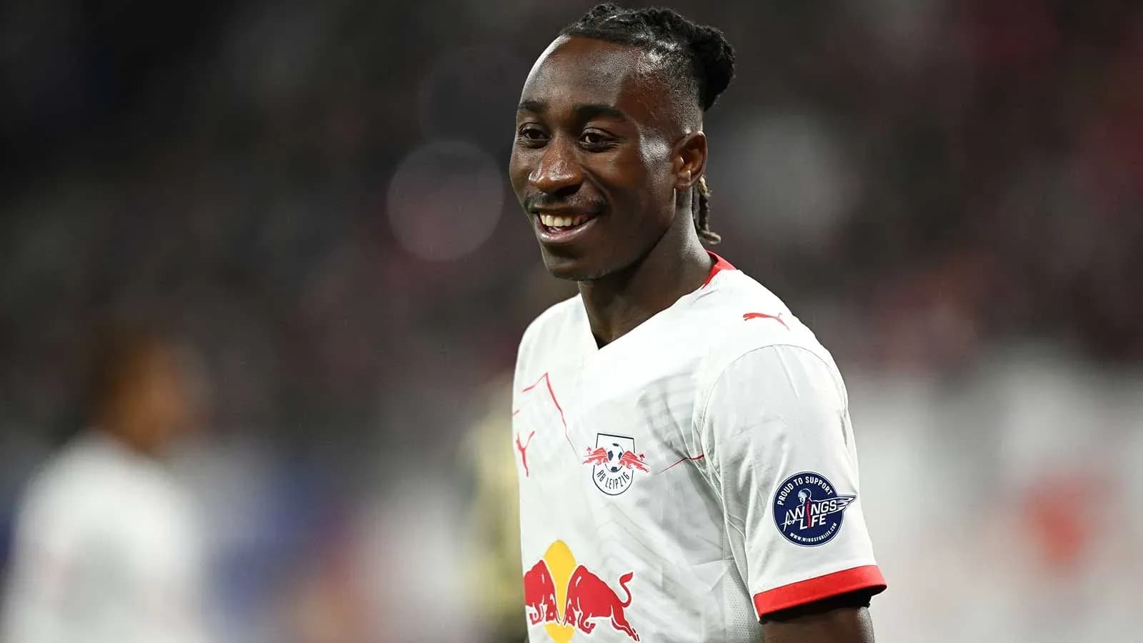 RB Leipzig player smiling during match RB Leipzig player smiling during match