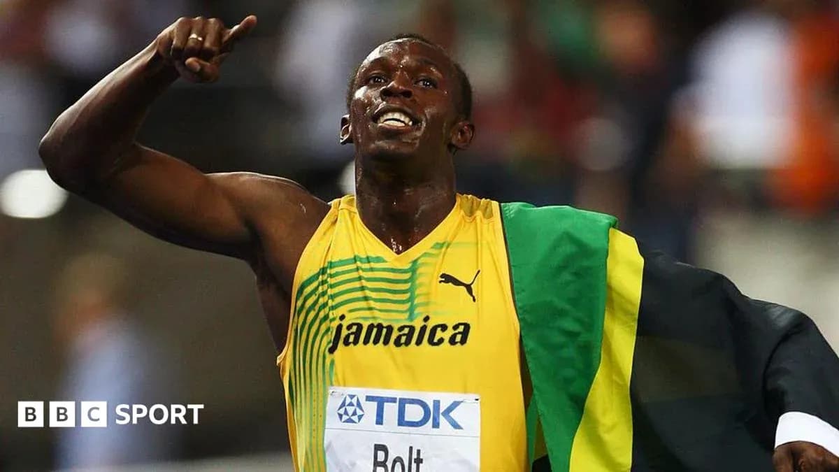 Athlete celebrating with Jamaican flag after race Athlete celebrating with Jamaican flag after race