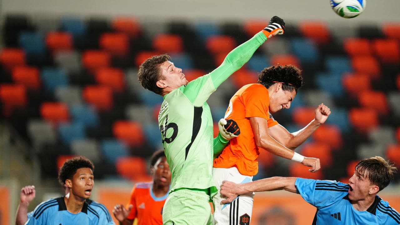 Goalkeeper punching the ball during match action Goalkeeper punching the ball during match action