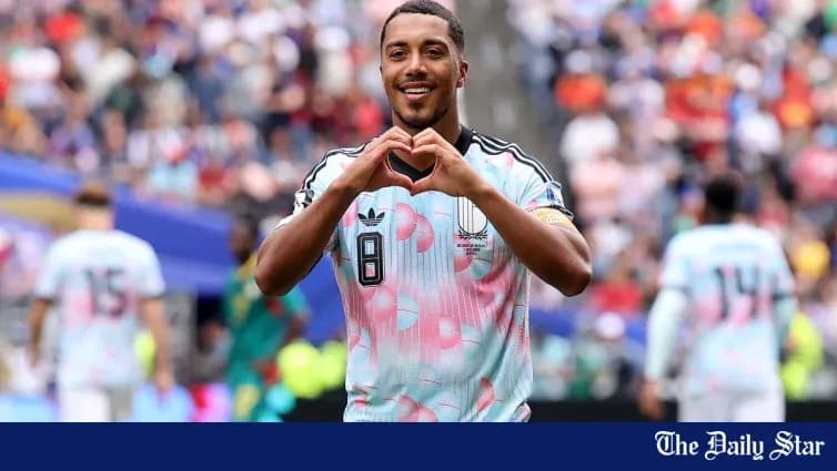 Player making a heart gesture after scoring Player making a heart gesture after scoring