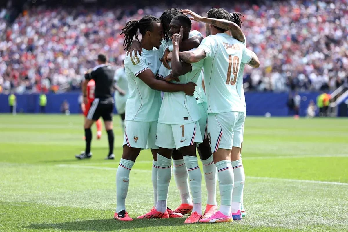 French players celebrating a goal on the field French players celebrating a goal on the field