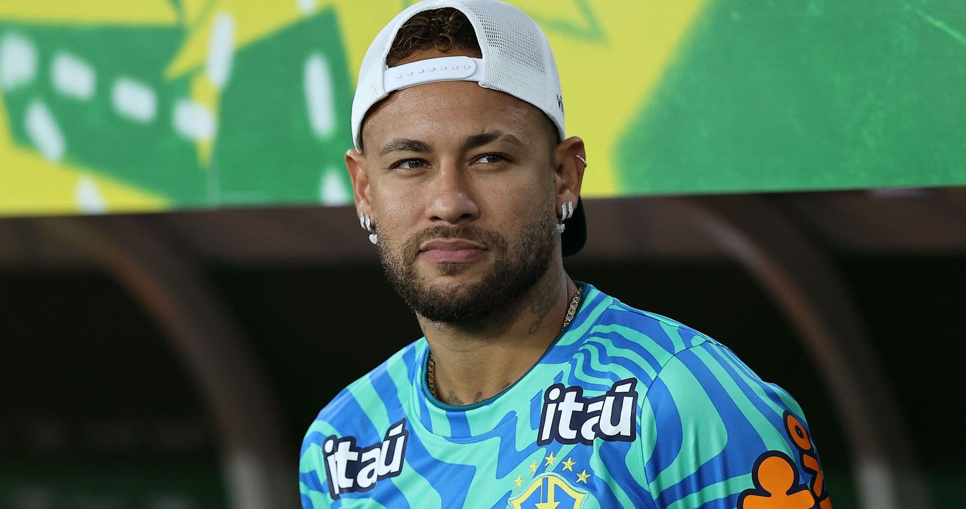 Player wearing Brazil team jersey on bench Player wearing Brazil team jersey on bench