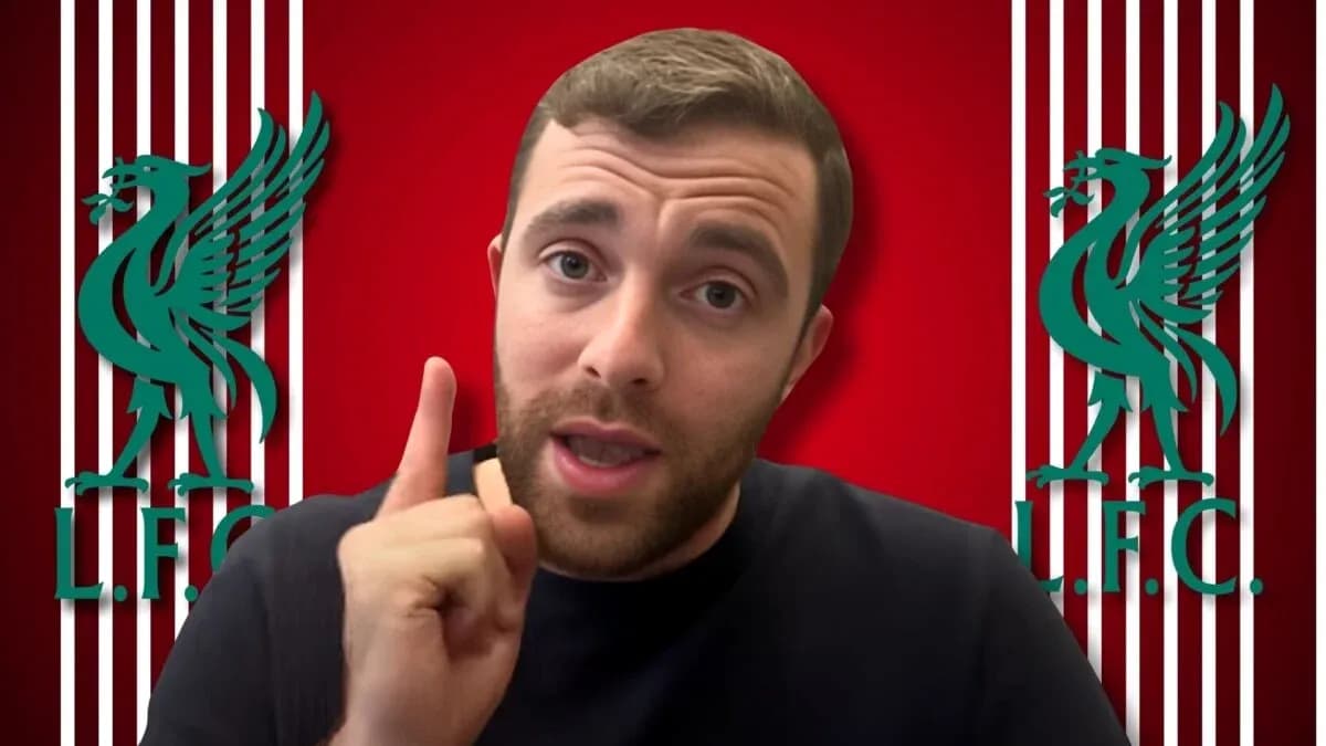 Person speaking with Liverpool FC logo background Person speaking with Liverpool FC logo background