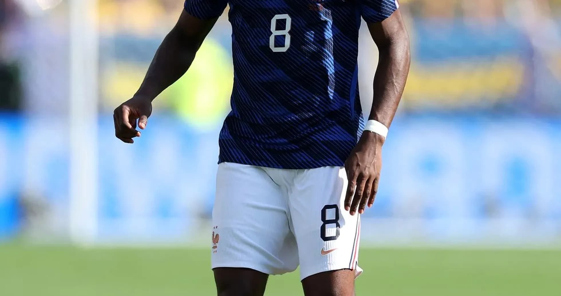Player in France kit preparing to kick soccer ball Player in France kit preparing to kick soccer ball
