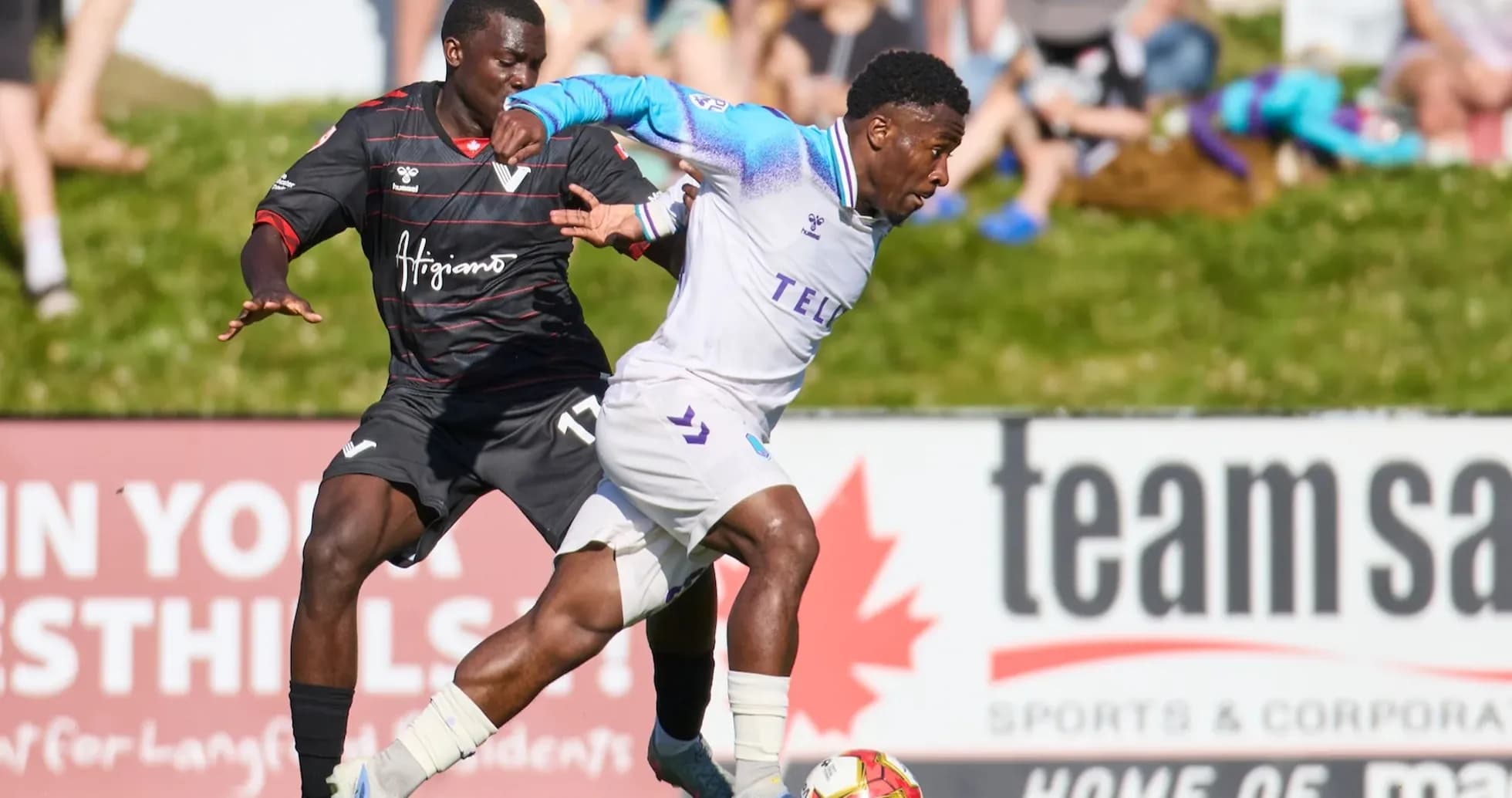 Player tackling opponent during Pacific FC match Player tackling opponent during Pacific FC match