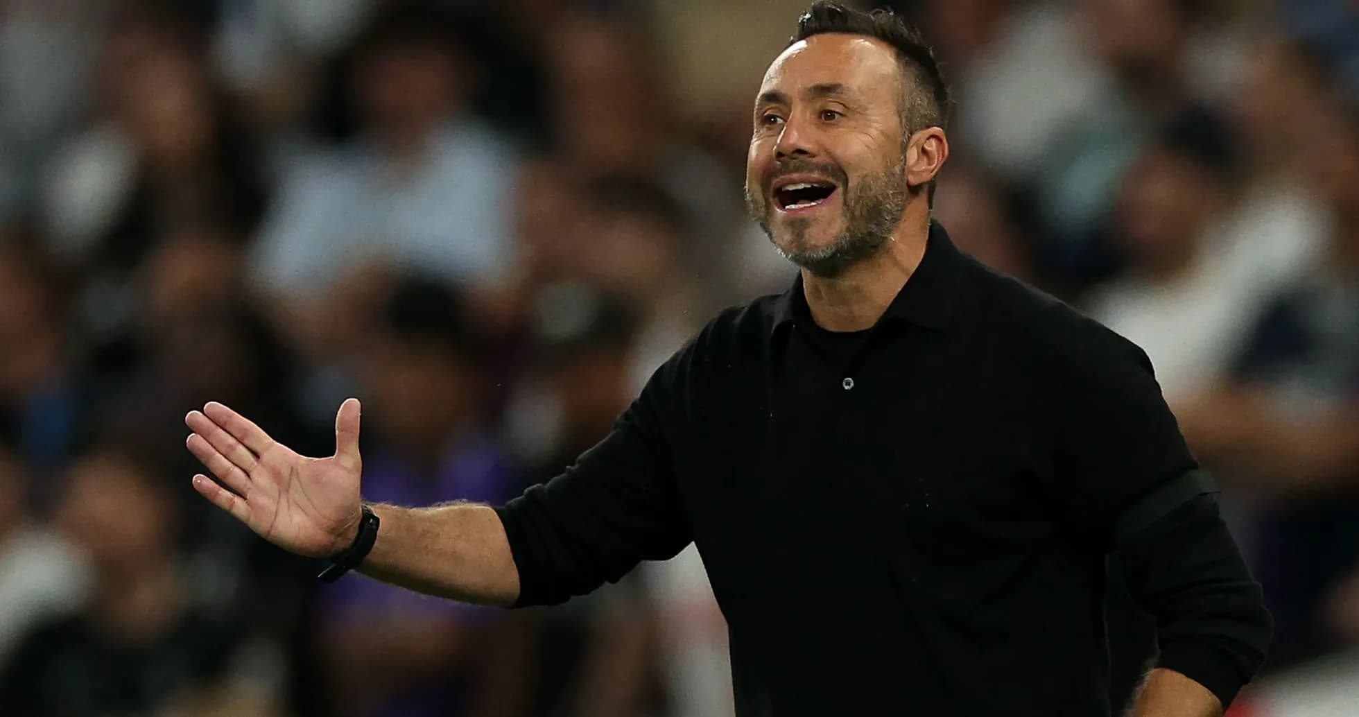 Coach gesturing during a match from the sideline Coach gesturing during a match from the sideline
