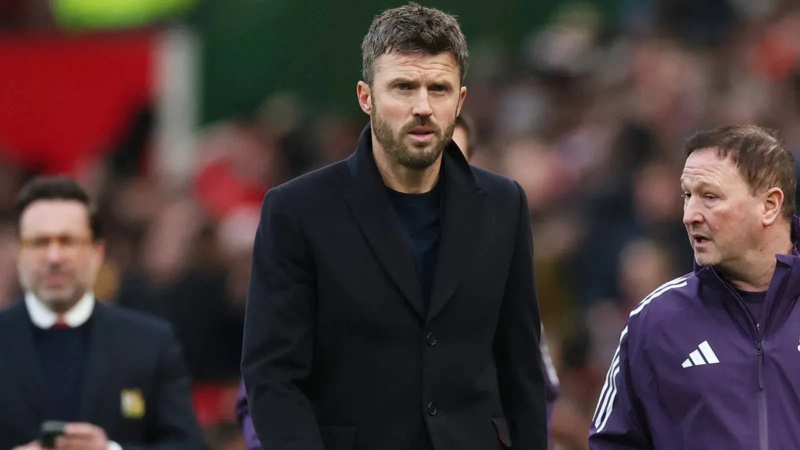Coach walking on the sideline during a match Coach walking on the sideline during a match