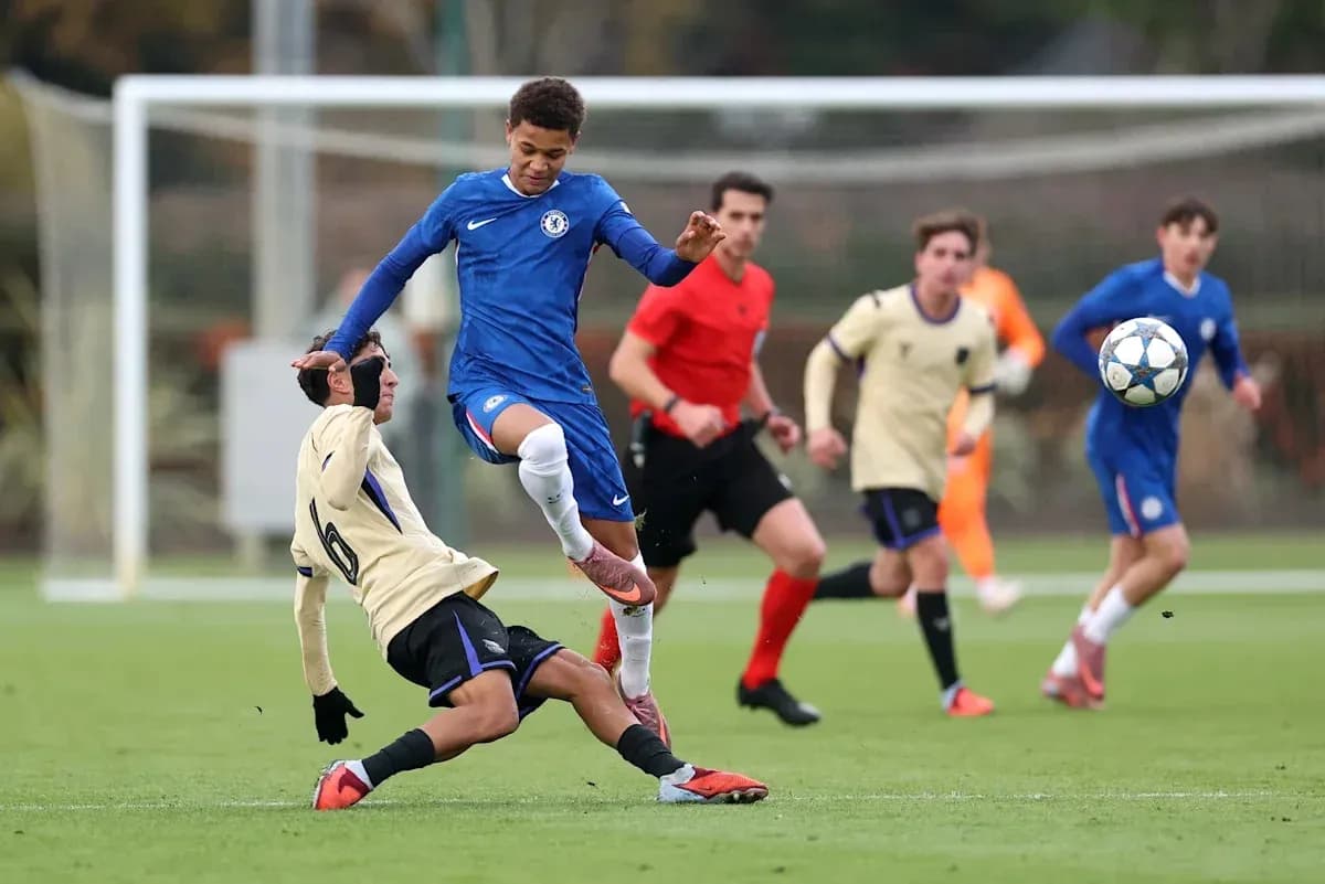 Player from Chelsea evades tackle during match Player from Chelsea evades tackle during match