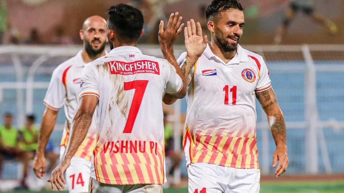 Players celebrating a goal during a football match Players celebrating a goal during a football match