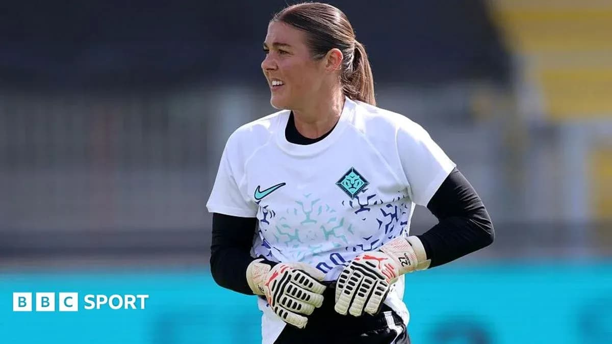 Goalkeeper training in white jersey with gloves Goalkeeper training in white jersey with gloves